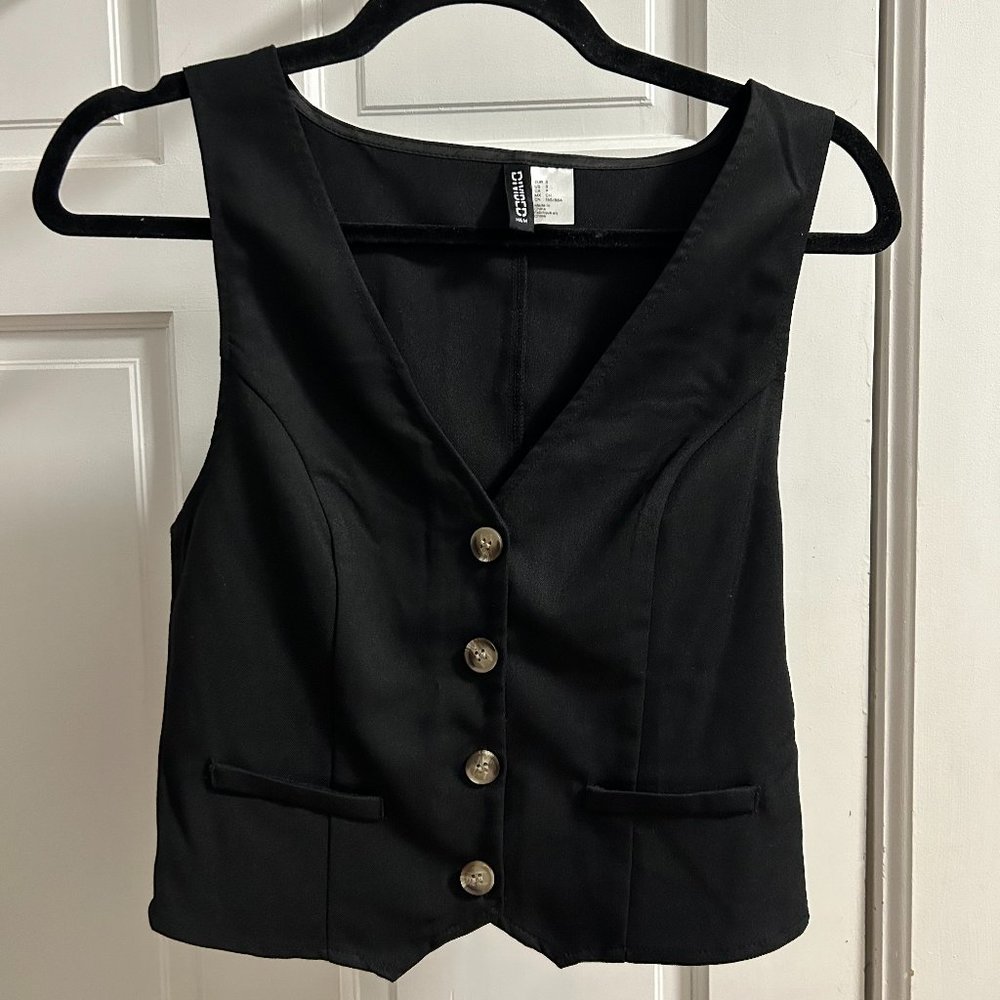 Black fitted vest